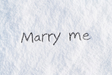 Top view of the inscription "Marry me" made on the roof, top view. The concept of Valentine's day.