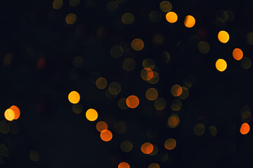 Golden lights abstract background. Blurred glowing lights with bokeh
