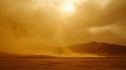 Fototapeta premium Intense desert dust storm with sun behind hazy clouds and mountains.