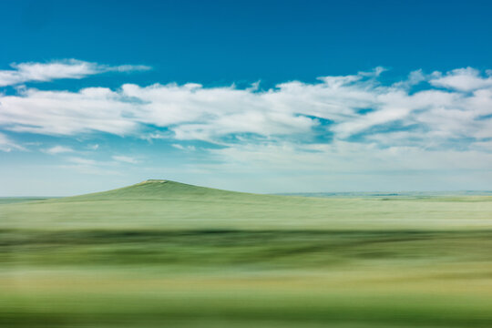 Hilltop distance with moving foreground-driving in car