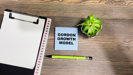 Concept of Gordon Growth Model write on sticky notes isolated on Wooden Table.