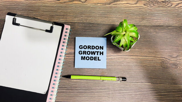 Concept of Gordon Growth Model write on sticky notes isolated on Wooden Table.