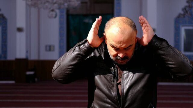Man Raising his Hands Praying Mosque