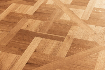 Vintage parquet made of oak wood planks with geometric pattern