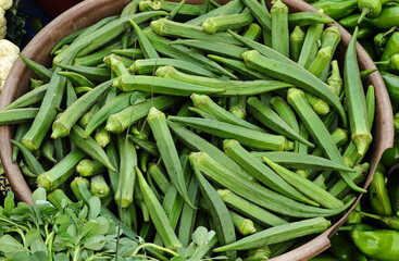 Okra lady finger, Bhindi, Fresh green roselle, ingredient of asian food. Okra or Okro Abelmoschus esculentus as ladies' fingers or ochro is a flowering plant in the mallow family. exotic vegetables.