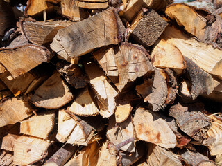 Firewood in the firewood stove creates coziness and warmth, filling the house with an atmosphere of comfort and disposing to family gatherings.