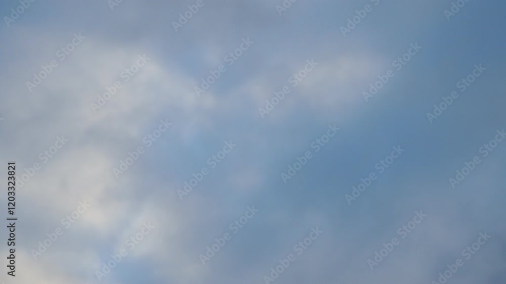 Poster observe dynamic flow of clouds against a vibrant blue sky, real time capture. experience gradual shi