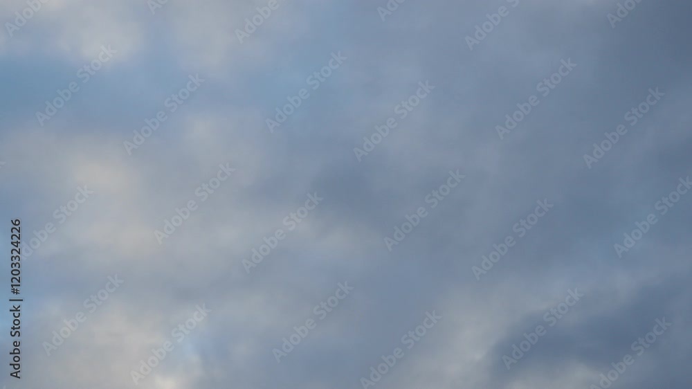 Poster observe dynamic flow of clouds against a vibrant blue sky, real time capture. experience gradual shi