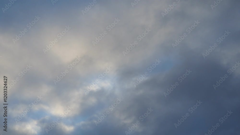 Poster observe dynamic flow of clouds against a vibrant blue sky, real time capture. experience gradual shi
