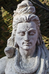 Obraz premium A Fine art Sculpture, semi finished, of Lord Shiva, carved in stone, worshipped during Maha Shivaratri in India.