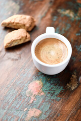 Cup of coffee and Cantuccini (Italian cookie) on dark wooden background. Copy space.