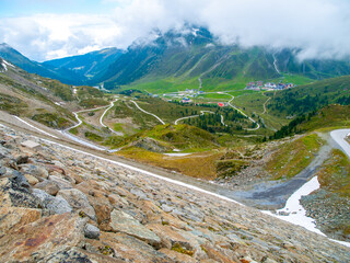 Overlooking the Finstertal Dam in Kuhtai, the landscape revels in the lush colors of spring with...