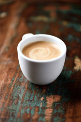 Cup of coffee on wooden background. Soft focus. Copy space.
