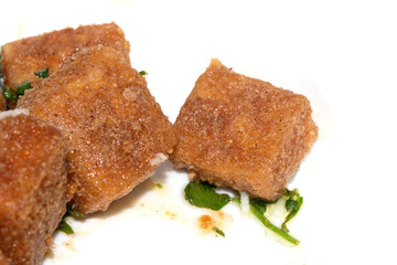 Well Season Batter Fried Tofu Chunks on White Background