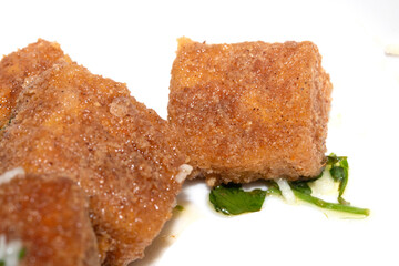 Well Season Batter Fried Tofu Chunks on White Background