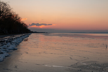frozen lakeside sunset 
