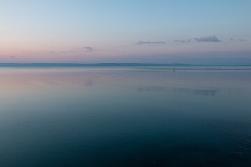 Calm lake water in a winter sunset.