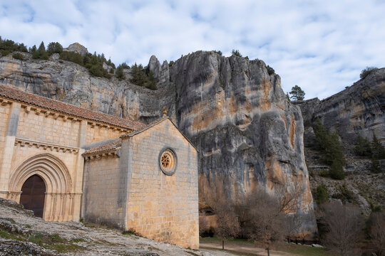 main door of the romanic hermitage of San Bartolome surrounded by rocky cliffs in the canyon of the River Lobos, Ucero, Soria, Spain