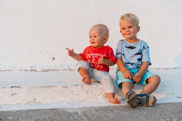 Fototapeta premium Two happy little children playing outdoors.