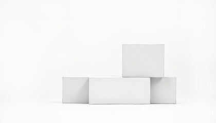 Minimalistic arrangement of white blocks on a clean backdrop.