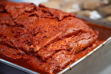 Cecina from Oaxaca. Mexican sliced cured pork or beef meat from Oaxaca displayed in a butcher shop...