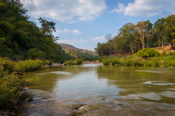 A river flowing through the middle of the mountains.