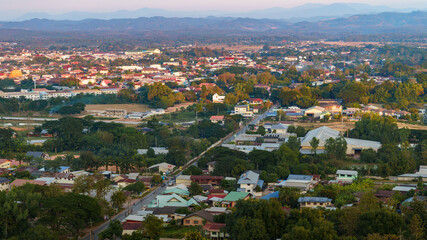 The cityscape in the photo, captured from a high angle, shows a large number of houses. This view would be perfect for creating a background image.