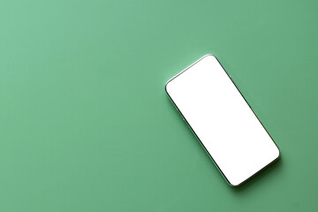 Smartphone with blank screen over light green background, perfect for app design mockups, digital product presentations, or user interface demonstrations in a minimalistic style.