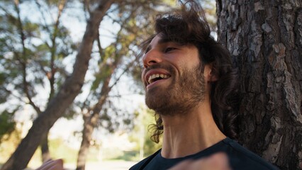 Long Hair Man Trains Gym Barbell Near Outdoor In Tree In Nature