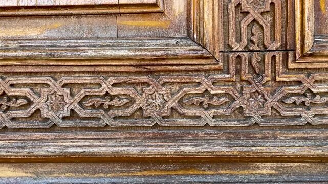 Wooden carving patterns on the doors of a Muslim mosque