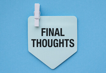 Final Thoughts words written on blue paper piece with blue background. Conceptual final thoughts...