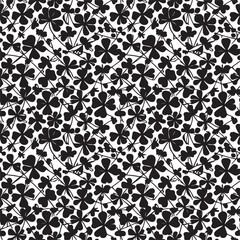 Black clover leaves on white background. St.Patrick 's Day. Isolated on white background. Abstract graphic black-white stock illustration. Template for coloring, textures and another design.