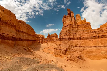 Fototapete Rund Big limestone walls of big Mongolian Grand canyon Khermen Tsav against blue sky. Gobi desert, Mongolia © cppzone