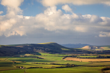 The wonderful views from Wilmington hill of the south downs towards Firle and Lewes east Sussex south east England UK © SuxxesPhoto