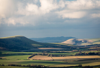 The wonderful views from Wilmington hill of the south downs towards Firle and Lewes east Sussex south east England UK
