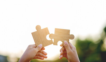 Jigsaw puzzle pieces of cooperation in working, unity and teamwork, goals and success in working