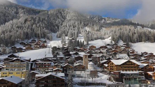 Fast Aerial View of Church in Adelboden, Switzerland in winter