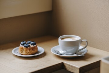 Blueberry Pastry and Cappuccino Coffee Enjoyment
