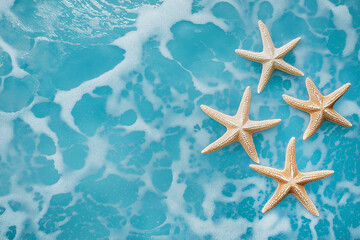 Four starfishes are floating on turquoise sea water with white foam, creating a beautiful summer background