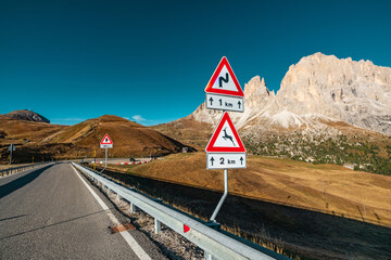 Scenic Mountain Road Signs in the Italian Alps