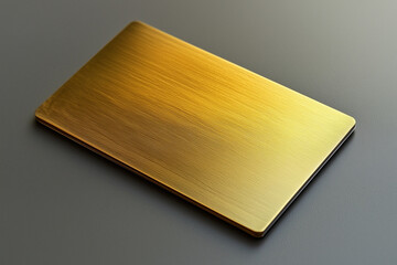Sleek gold card with brushed texture on dark surface, reflecting light elegantly