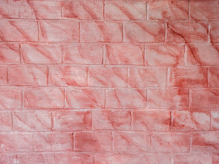 Fototapeta premium brick wall with texture of pink and orange paint scratches