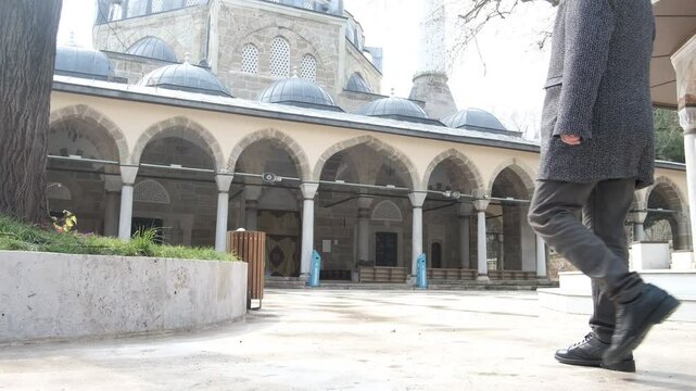 Man looking at mosque