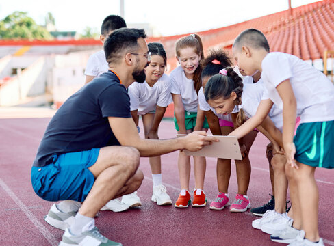 child sport athlete competition running coach teamwork exercise kid fitness training athletic young active girl game group play team childhood school action exercising
