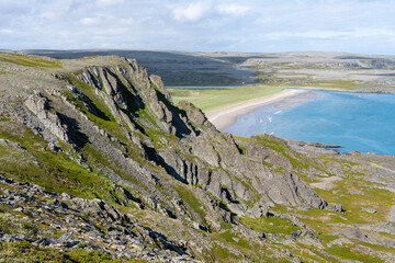 Scenic view over Sandfjord near the village of Hamninberg in Varanger Peninsula, Northern Norway.