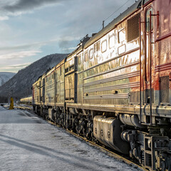 Train locomotive pulls wagons with cargo. Transportation industry	