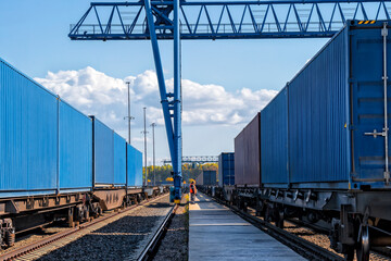 Train traffic. Container loading and unloading station. Logistics railway hub