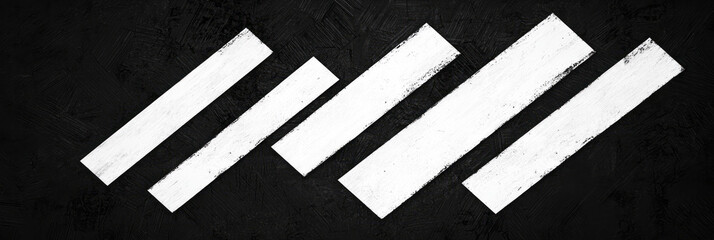 A high-contrast design with bold white diagonal lines cutting across a textured charcoal background, creating visual impact,