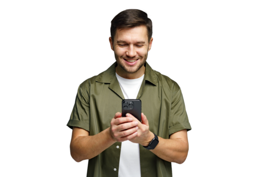 Young man smiling while using smartphone in a bright and modern environment