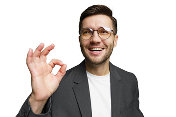 Young man smiles enthusiastically while making an okay gesture in a business casual outfit